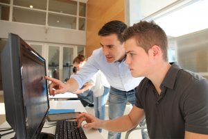 teacher-and-student-working-on-computer-1